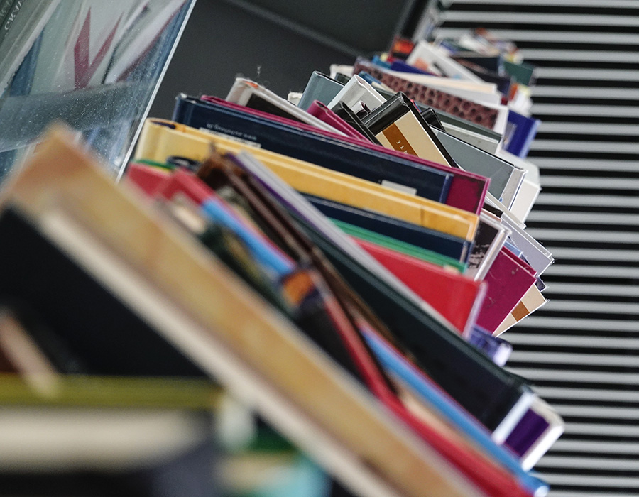 Row of unorganized and messy books