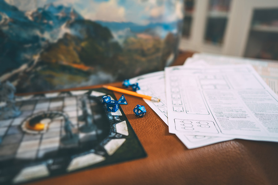 A standard 5e D&D setup with DM screen in the background.